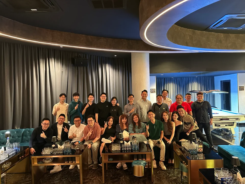 Team members posing together indoors